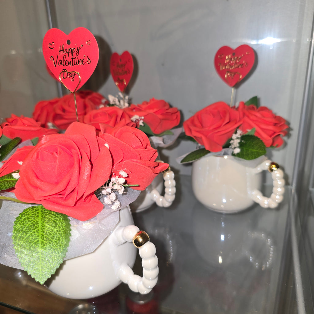 Cups with eternal roses and a message for Valentine's Day