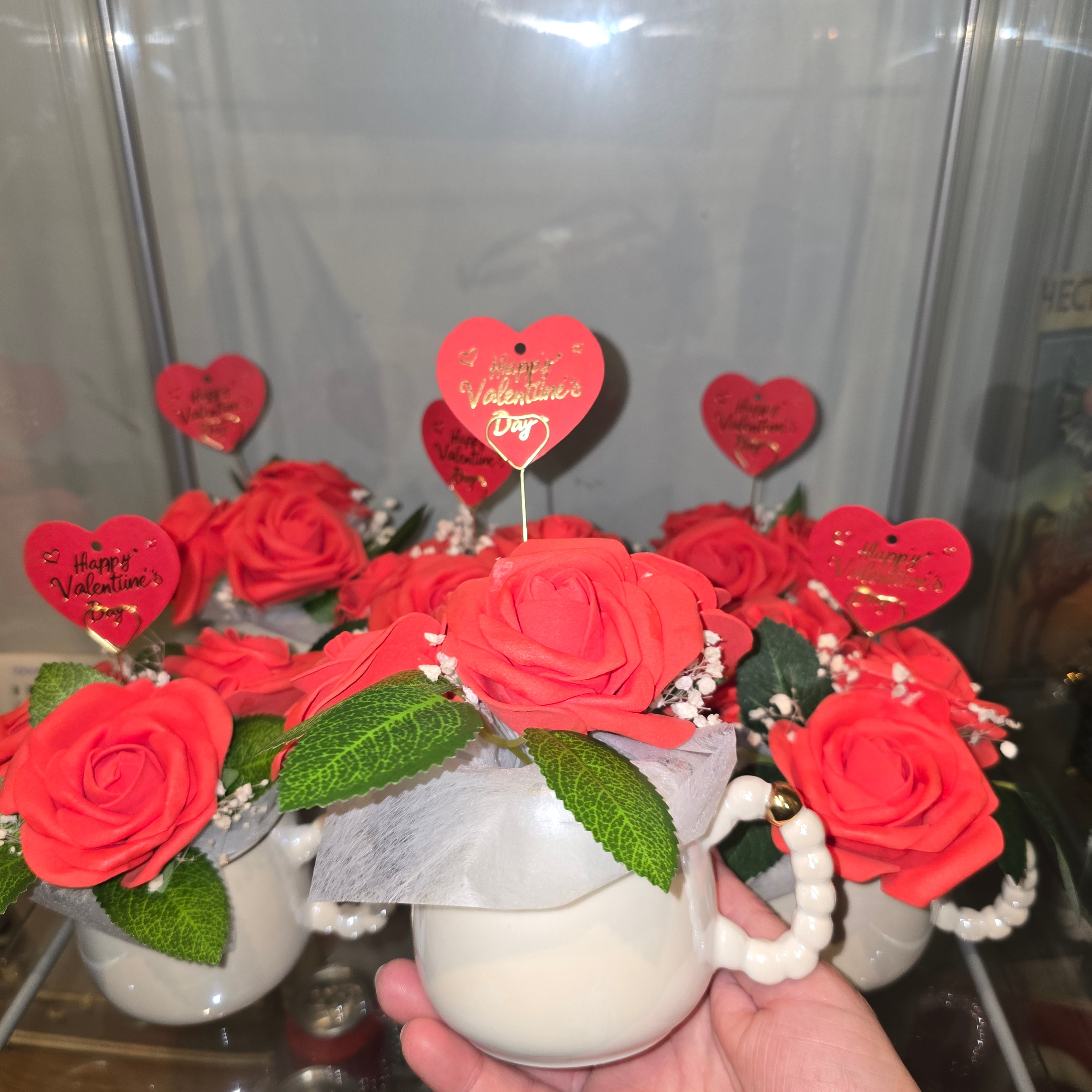 Cups with eternal roses and a message for Valentine's Day