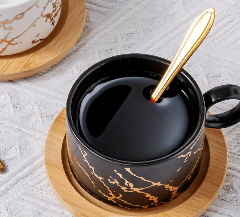 Ceramic Coffee Cup Set with Saucer, Spoon & Gold Stand – Black & White (Set of 4)