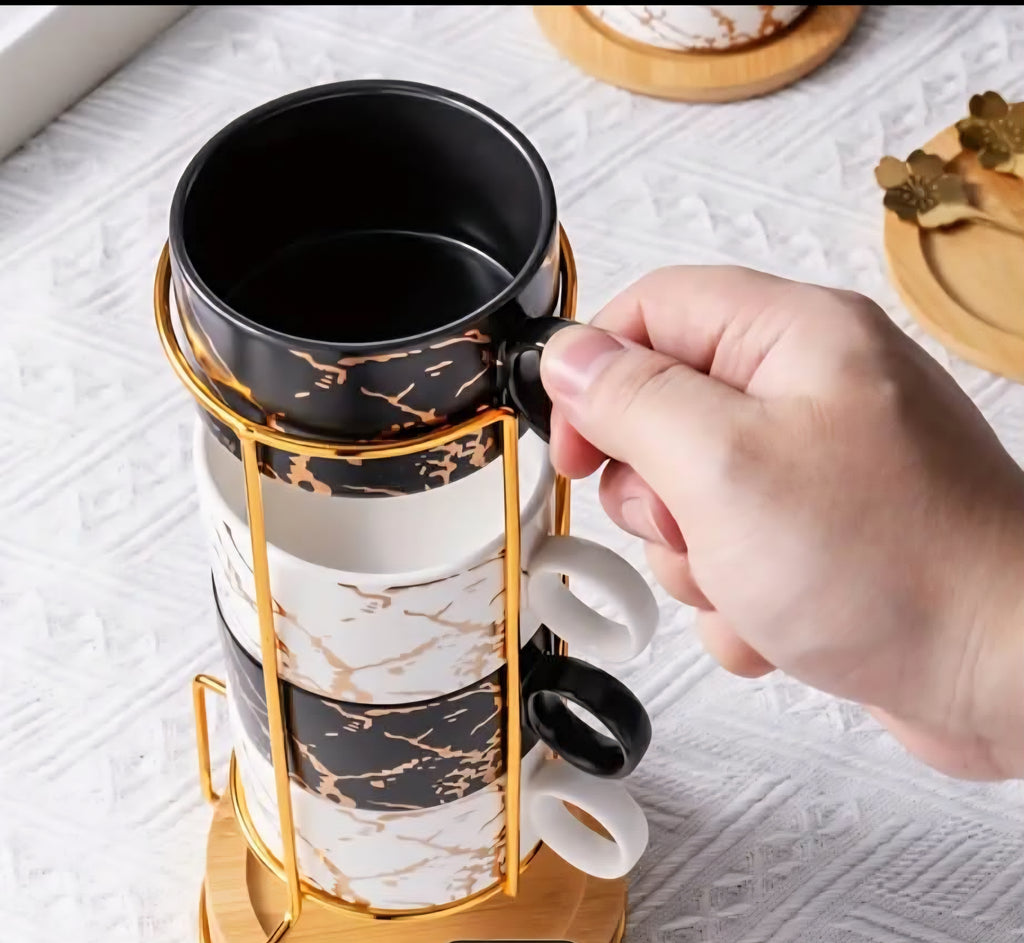 Ceramic Coffee Cup Set with Saucer, Spoon & Gold Stand – Black & White (Set of 4)